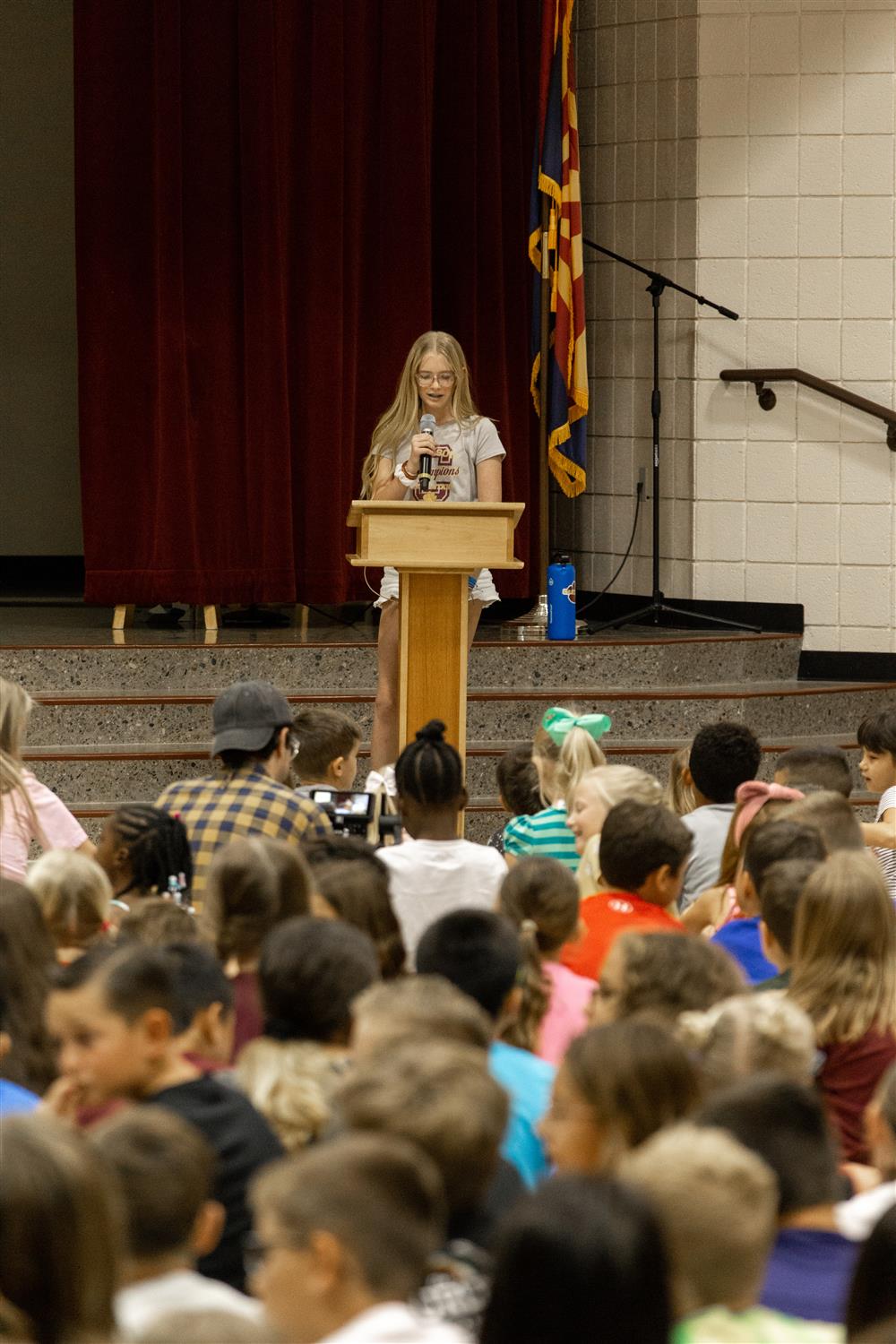 Sixth grade student Ella Piepenbrink presents a speech during Carlson Elementary School's 10th Anniversary Ceremony.